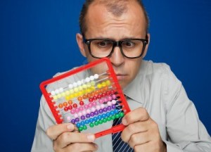 10024128-business-man-with-abacus-toy-calculator-over-blue-background[1]